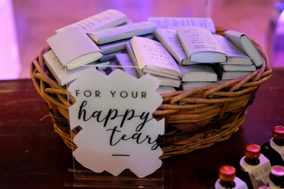 Basket of tissue pack favours with a For Your Happy Tears sign